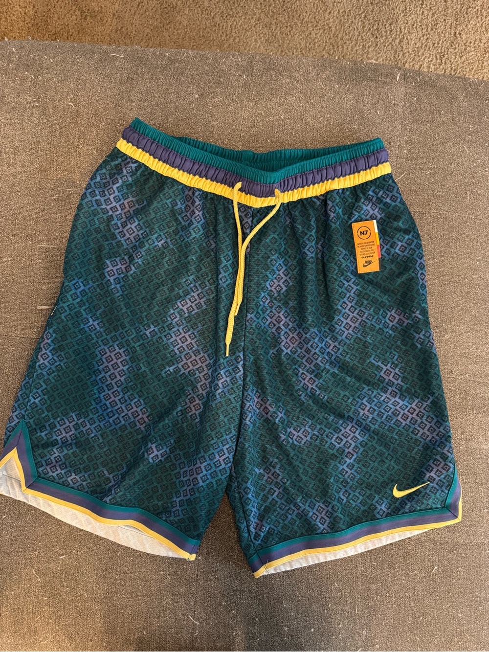 Nike Men's N7 Basketball Shorts in Bright Spruce with vibrant geometric pattern